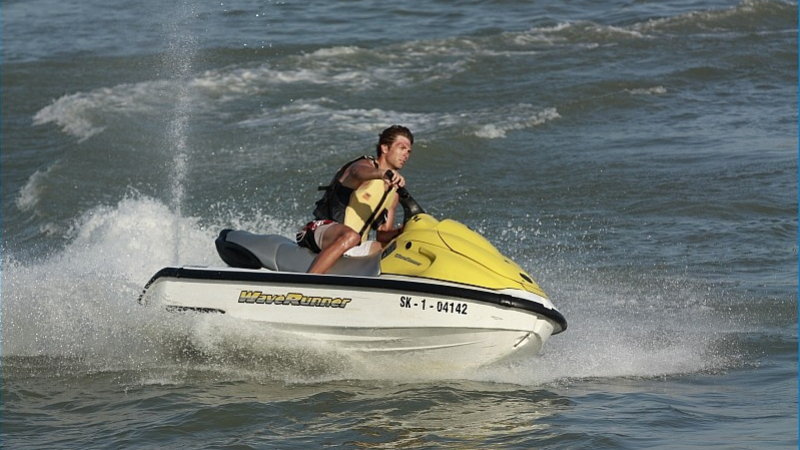 Man racing jet ski