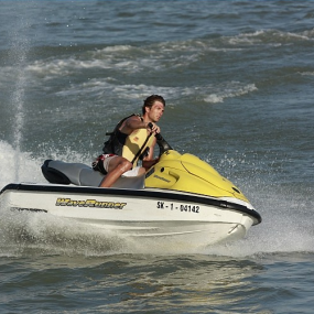 Man racing jet ski